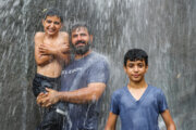 Iranians beat summer heat around Ganjnameh waterfall