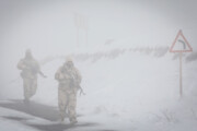 Iranian police guarding border in deep snow