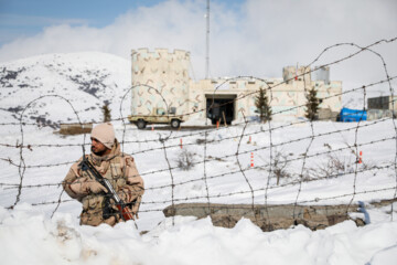 Iranian police guarding border in deep snow