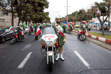 Motorcycle riders with the Iranian Armed Forces parade on Thursday, February 1, 2024 to mark the 45th anniversary of the return from exile of Imam Khomeini, the late founder of the Islamic Republic, ten days before the victory of the Islamic Revolution.