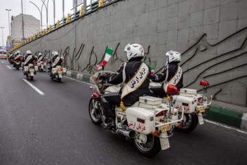 Motorcycle riders with the Iranian Armed Forces parade on Thursday, February 1, 2024 to mark the 45th anniversary of the return from exile of Imam Khomeini, the late founder of the Islamic Republic, ten days before the victory of the Islamic Revolution.