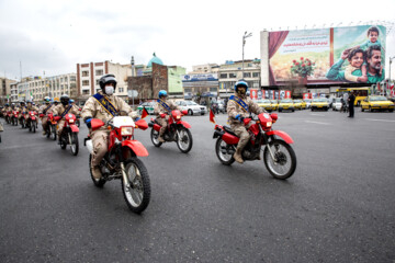 Motorcycle riders with the Iranian Armed Forces parade on Thursday, February 1, 2024 to mark the 45th anniversary of the return from exile of Imam Khomeini, the late founder of the Islamic Republic, ten days before the victory of the Islamic Revolution.