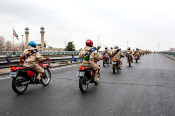 Motorcycle riders with the Iranian Armed Forces parade on Thursday, February 1, 2024 to mark the 45th anniversary of the return from exile of Imam Khomeini, the late founder of the Islamic Republic, ten days before the victory of the Islamic Revolution.