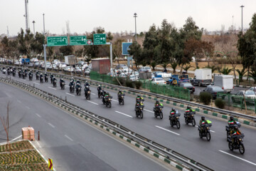 Motorcycle riders with the Iranian Armed Forces parade on Thursday, February 1, 2024 to mark the 45th anniversary of the return from exile of Imam Khomeini, the late founder of the Islamic Republic, ten days before the victory of the Islamic Revolution.