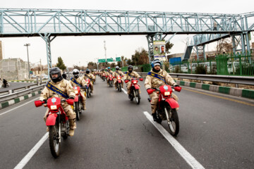 Motorcycle riders with the Iranian Armed Forces parade on Thursday, February 1, 2024 to mark the 45th anniversary of the return from exile of Imam Khomeini, the late founder of the Islamic Republic, ten days before the victory of the Islamic Revolution.