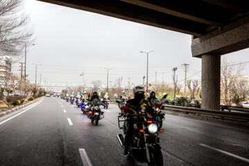 Motorcycle riders with the Iranian Armed Forces parade on Thursday, February 1, 2024 to mark the 45th anniversary of the return from exile of Imam Khomeini, the late founder of the Islamic Republic, ten days before the victory of the Islamic Revolution.