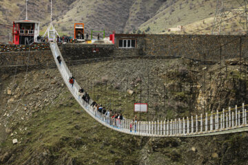 Tourists visiting Iran's largest glass suspension bridge