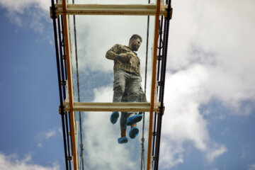Tourists visiting Iran's largest glass suspension bridge