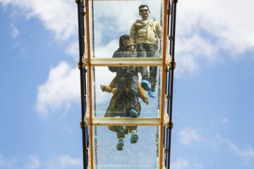 Tourists visiting Iran's largest glass suspension bridge