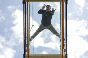 Tourists visiting Iran's largest glass suspension bridge