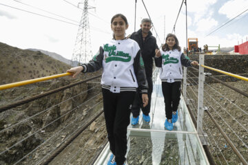 Tourists visiting Iran's largest glass suspension bridge
