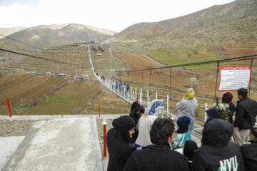 Tourists visiting Iran's largest glass suspension bridge