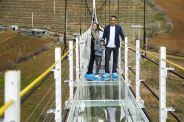 Tourists visiting Iran's largest glass suspension bridge