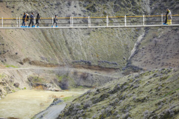 Tourists visiting Iran's largest glass suspension bridge