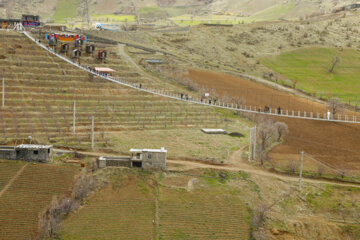 Tourists visiting Iran's largest glass suspension bridge