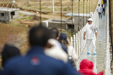 Tourists visiting Iran's largest glass suspension bridge