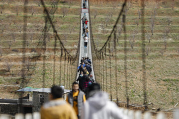 Tourists visiting Iran's largest glass suspension bridge