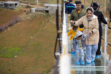 Tourists visiting Iran's largest glass suspension bridge