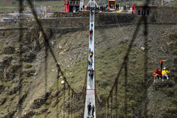 Tourists visiting Iran's largest glass suspension bridge