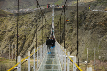 Tourists visiting Iran's largest glass suspension bridge