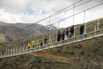 Tourists visiting Iran's largest glass suspension bridge