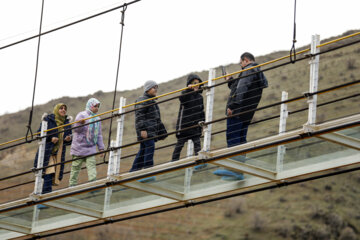 Tourists visiting Iran's largest glass suspension bridge