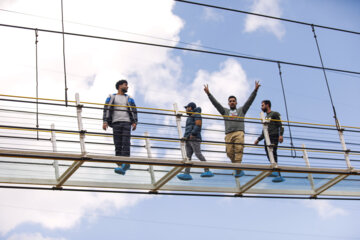 Tourists visiting Iran's largest glass suspension bridge