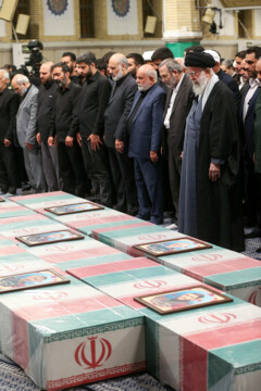 Supreme Leader praying over bodies of seven martyrs