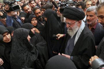 Supreme Leader praying over bodies of seven martyrs