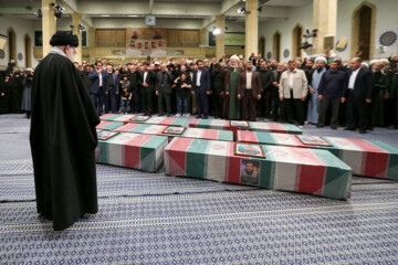 Supreme Leader praying over bodies of seven martyrs