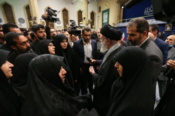 Supreme Leader praying over bodies of seven martyrs