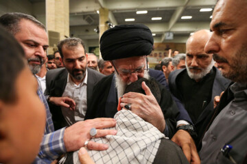 Supreme Leader praying over bodies of seven martyrs