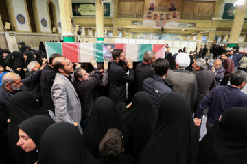 Supreme Leader praying over bodies of seven martyrs