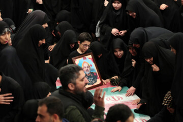 Supreme Leader praying over bodies of seven martyrs