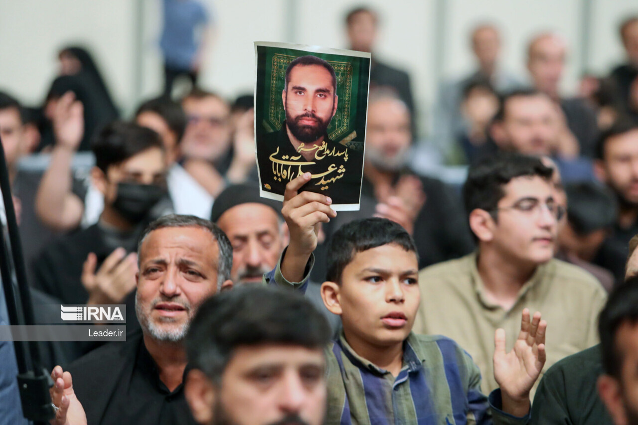 Supreme Leader praying over bodies of seven martyrs Supreme Leader praying over bodies of seven martyrs