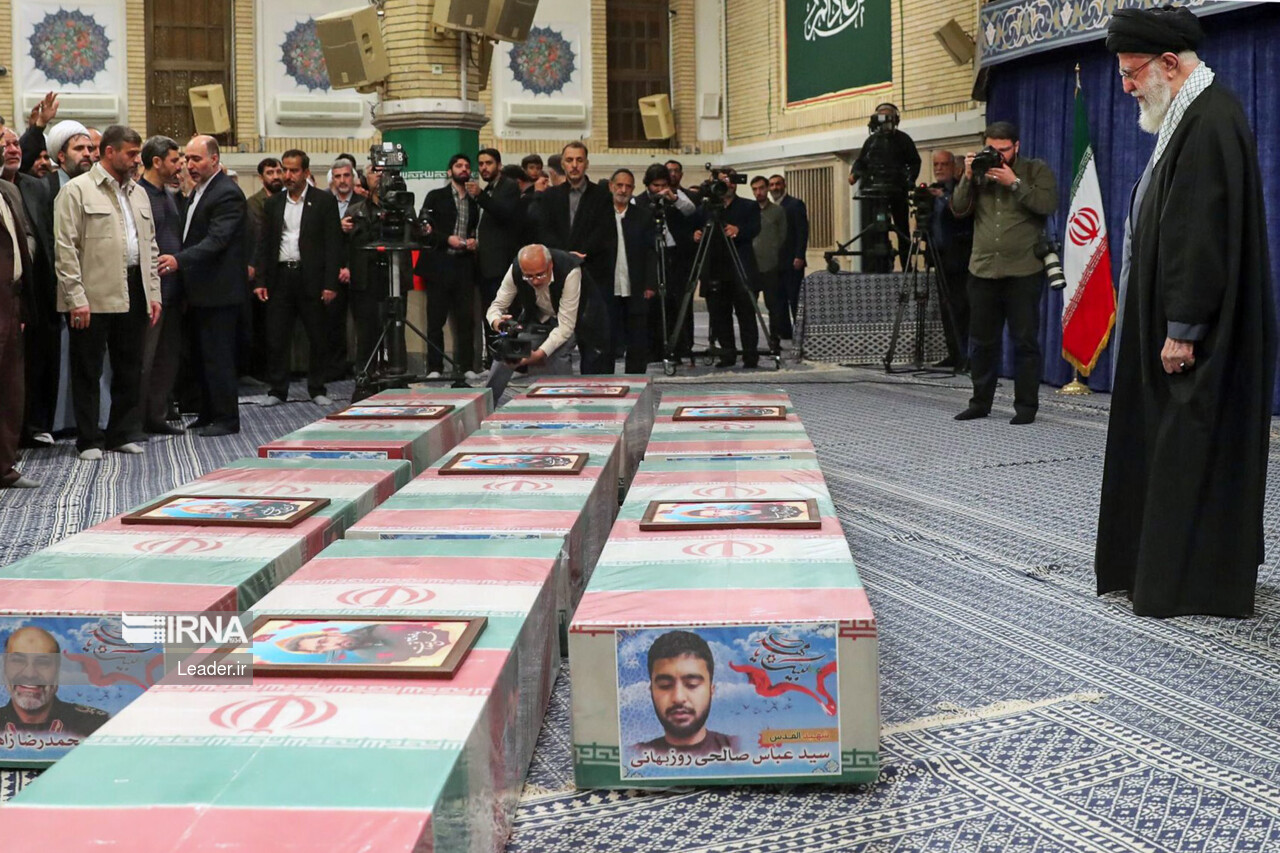 Supreme Leader praying over bodies of seven martyrs Supreme Leader praying over bodies of seven martyrs