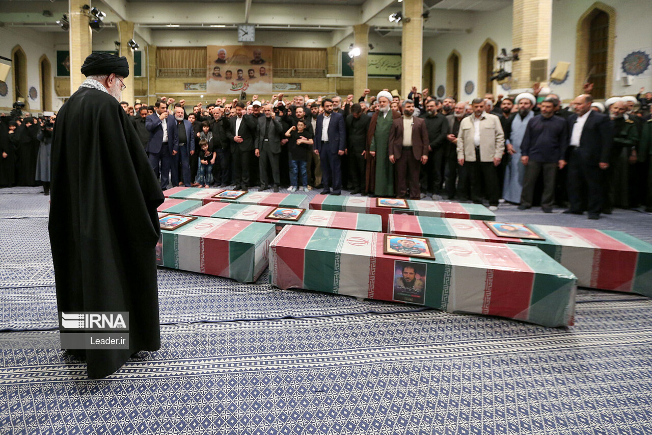 Supreme Leader praying over bodies of seven martyrs Supreme Leader praying over bodies of seven martyrs