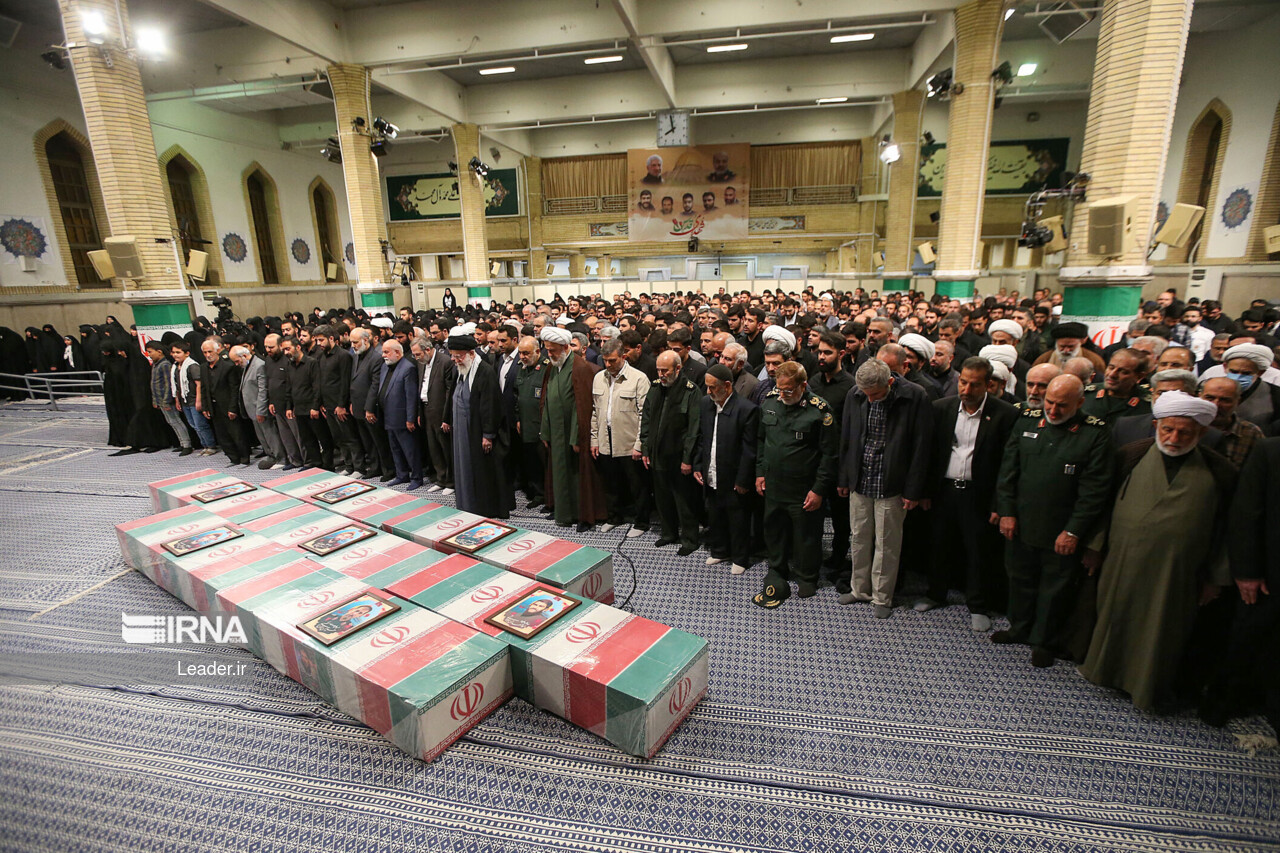Supreme Leader praying over bodies of seven martyrs Supreme Leader praying over bodies of seven martyrs