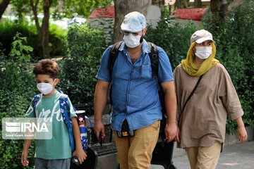 Iranians wearing masks in public places