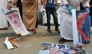 معترضان علیه سازش در غزه تصاویر شاه بحرین را آتش زدند