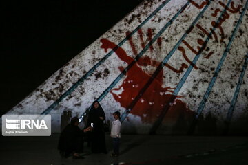 Azadi Tower lit, video mapped by memories of Islamic Revolution