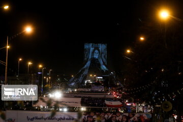 Azadi Tower lit, video mapped by memories of Islamic Revolution