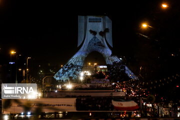 Azadi Tower lit, video mapped by memories of Islamic Revolution