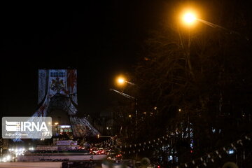 Azadi Tower lit, video mapped by memories of Islamic Revolution