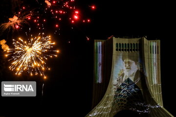 Azadi Tower lit, video mapped by memories of Islamic Revolution