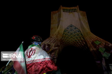 Azadi Tower lit, video mapped by memories of Islamic Revolution