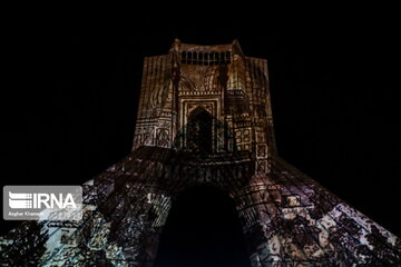 Azadi Tower lit, video mapped by memories of Islamic Revolution