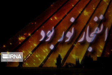 Azadi Tower lit, video mapped by memories of Islamic Revolution