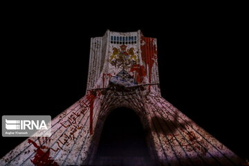 Azadi Tower lit, video mapped by memories of Islamic Revolution