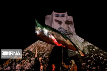 Azadi Tower lit, video mapped by memories of Islamic Revolution